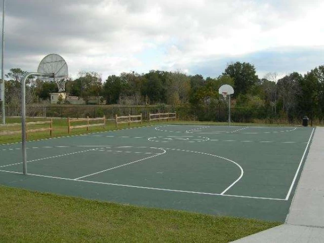 Streetball courts are located in the park right next to soccer facilities.