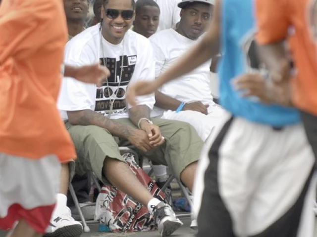 Carmelo Anthony watches the action at his own charity tournament...