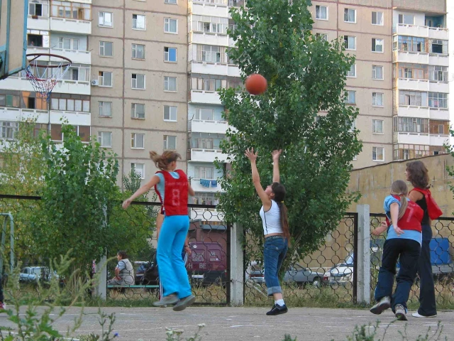 Some russian girls playing basketball.