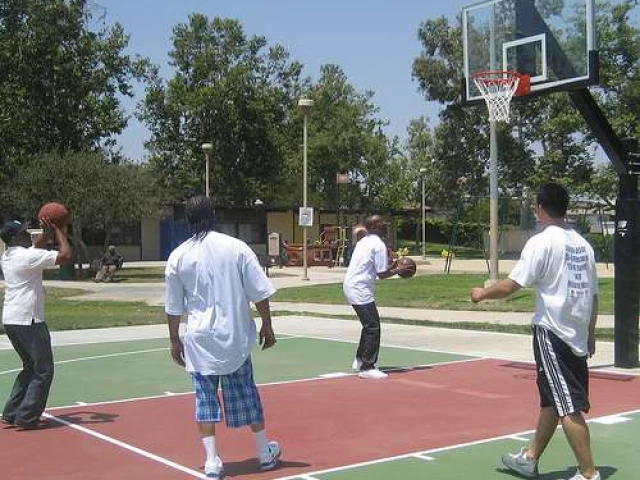State of the art basketball court with glass backboards and breakaway rims.